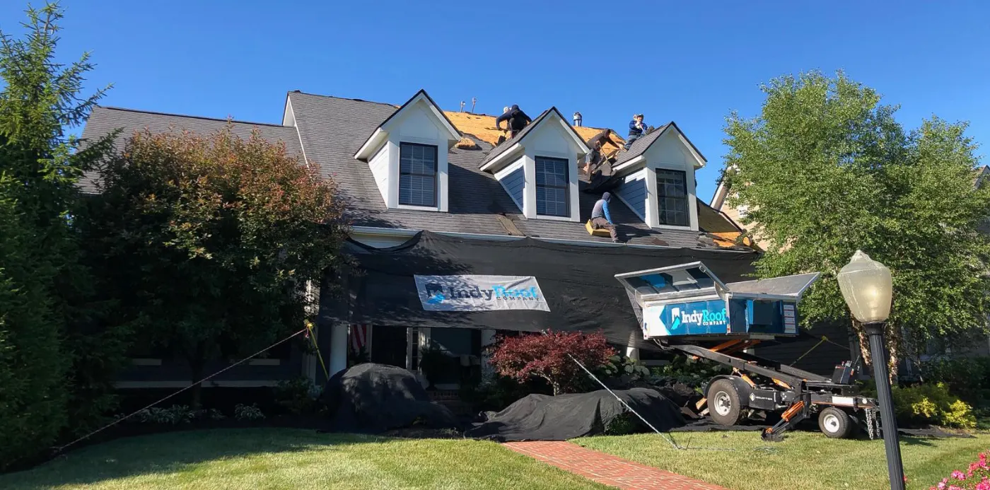 Tarping and dry-in on a Summit Lakes commercial roof